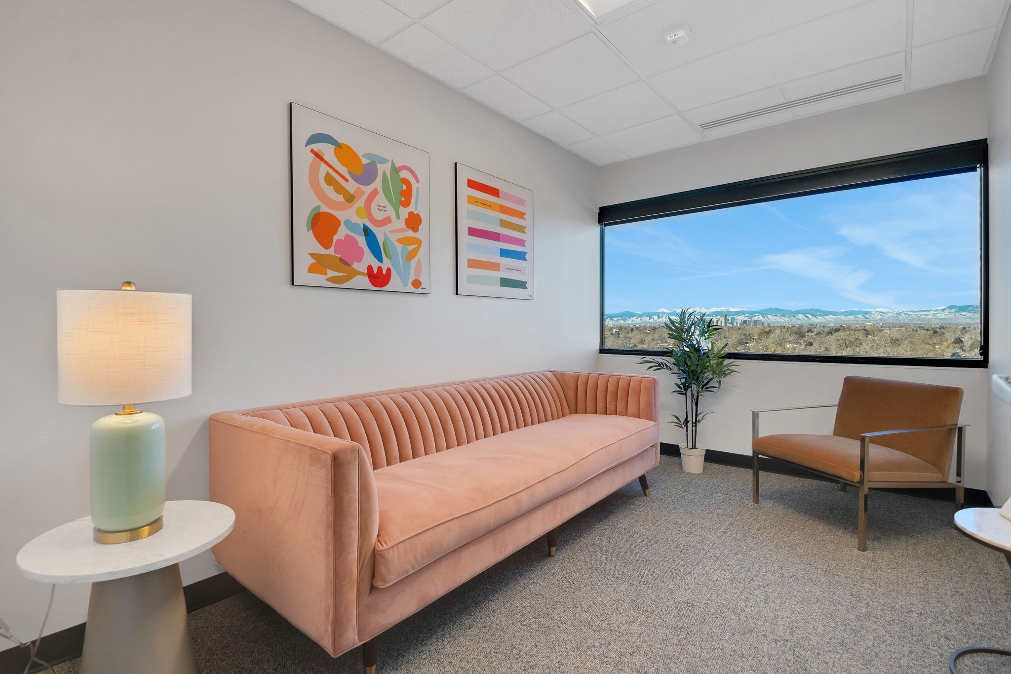 Individual meeting room with pink couch and chair