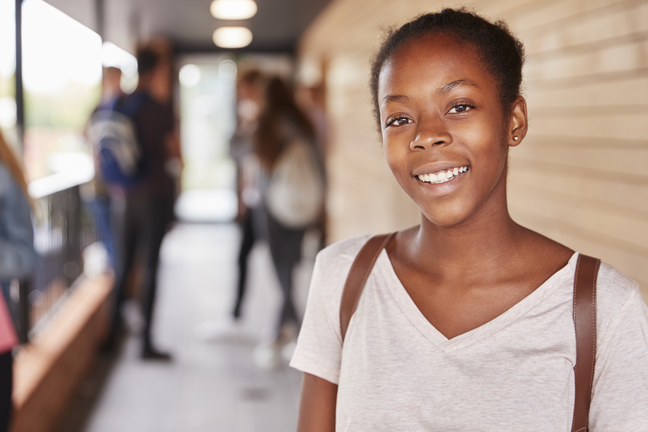 Portrait Of Female Teenage Student On College With Friends People at Counselling Session