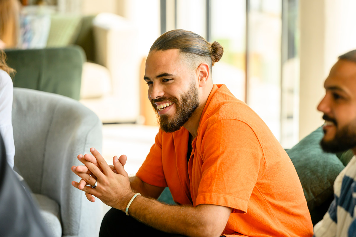 Diverse group of friends enjoying happy conversation and socializing